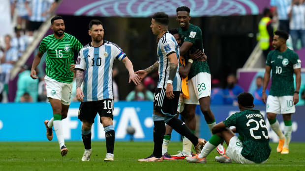 Saudi Arabia and Argentina players react at the end of their World Cup game